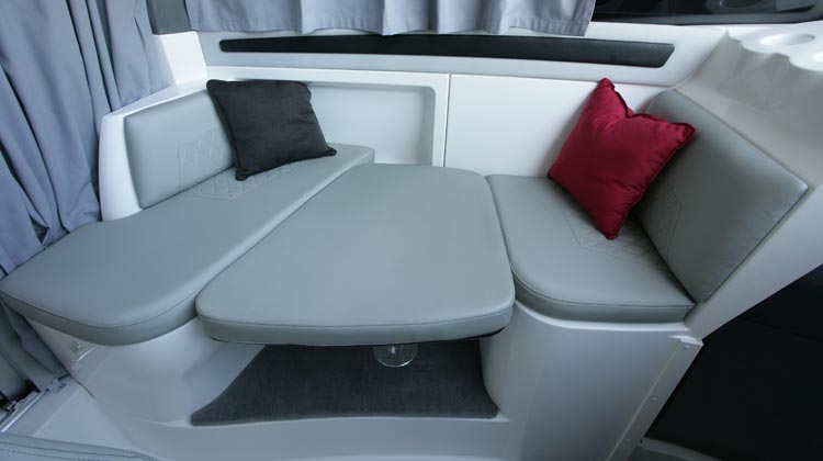U-dinette with drop-down/removable table and optional cushion to convert to berth